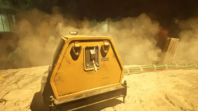Yellow generator with a highlighted startup handle and bundled cables