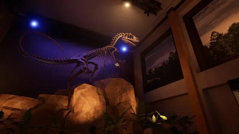 A torn paper fragment hangs from the reception Allosaurus skeleton hand above the rocks.