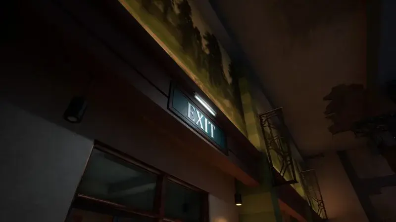 Illuminated Exit sign above the gift shop doorway