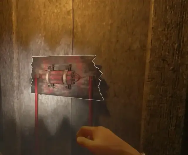 Dynamite bundle mounted on a wooden wall with red wiring