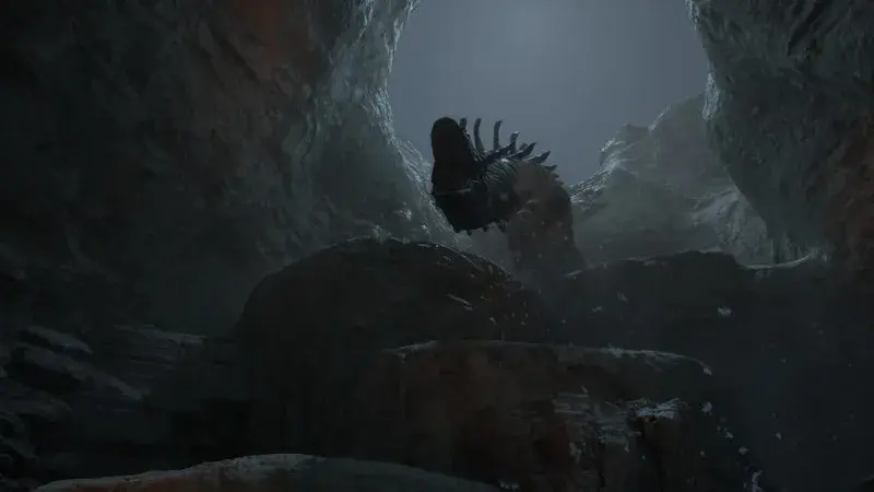 Brontosaurus head looming over a rocky cavern passage