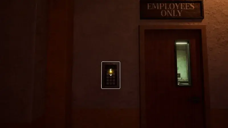 An Employees Only door with an illuminated keypad on the wall to its left.