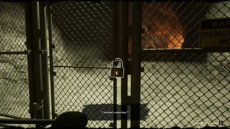 The locked chain-link gate and its padlock interaction in the caverns.